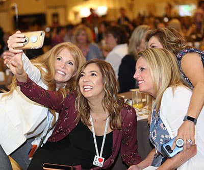 AADOM members taking a selfie at the annual AADOM Conference