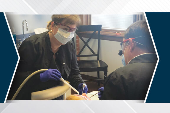 A dental assistant being trained to become the practice administrator
