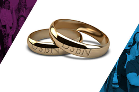 Two wedding rings sitting on top of each other