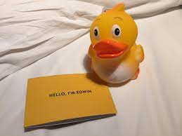 A rubber duck and handwritten note from the Apex hotel
