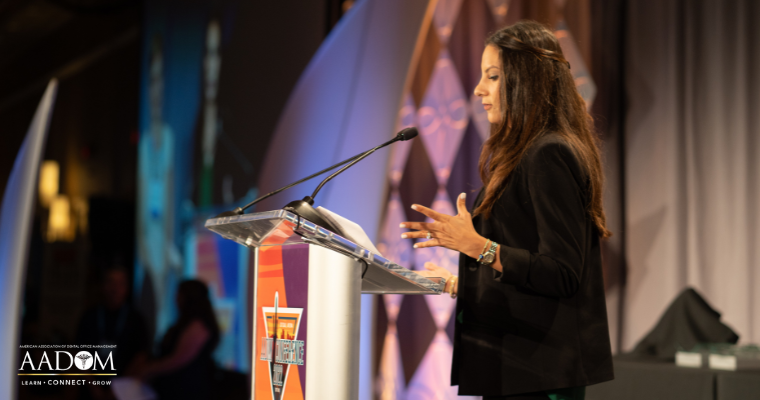 Jennifer Z. Vickery accepting Green Leader award at 2022 AADOM Conference